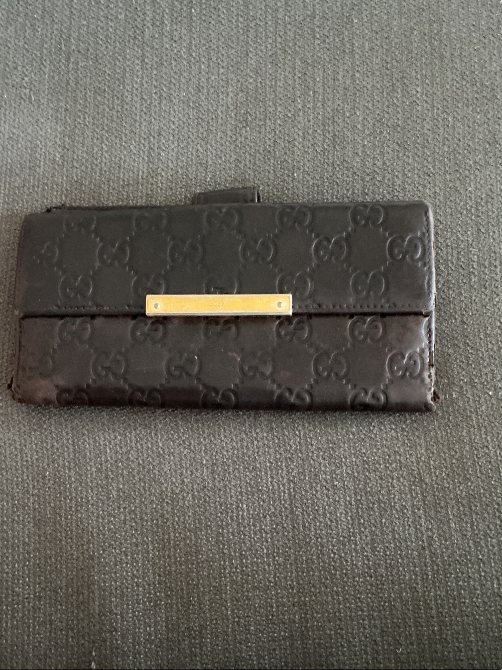 Gucci Brown Embossed GG Leather Wallet with Gold Accent